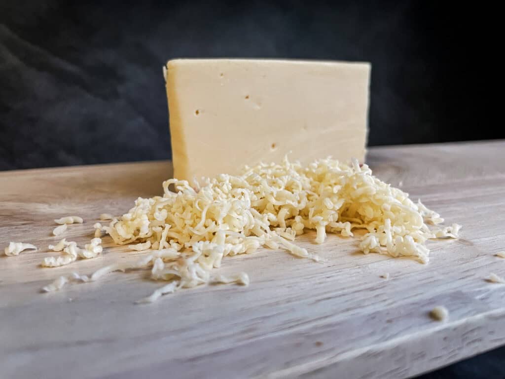 Freshly grated cheese for better mac and cheese 